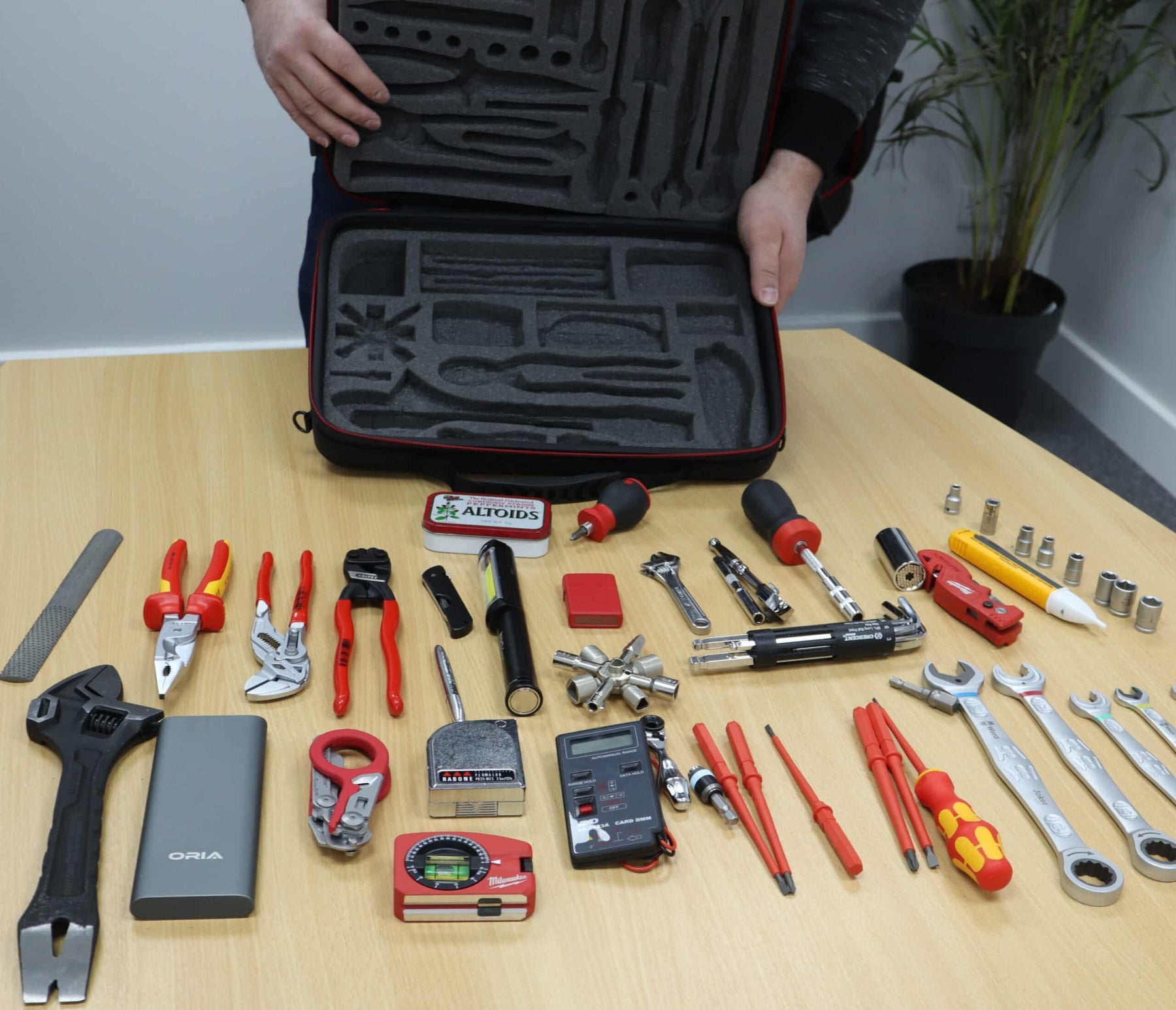 The foam inserts cut for tools and the tools out of the box demonstrating just how much can fit in there