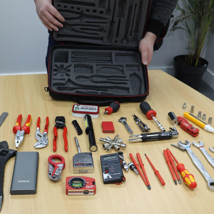 The foam inserts cut for tools and the tools out of the box demonstrating just how much can fit in there